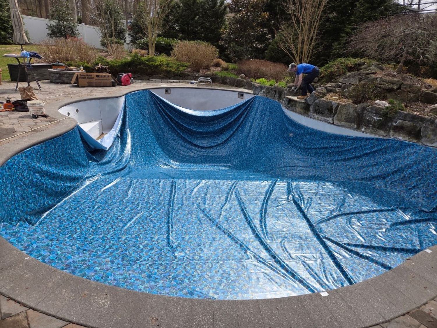 A new liner being set into a pool