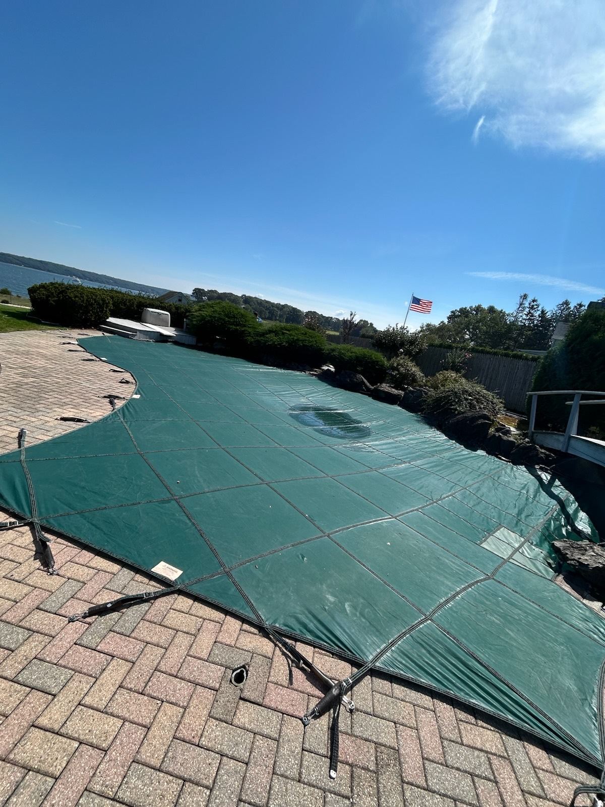 A safety cover fitted to an inground pool